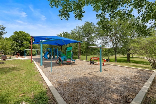 communal playground featuring a yard