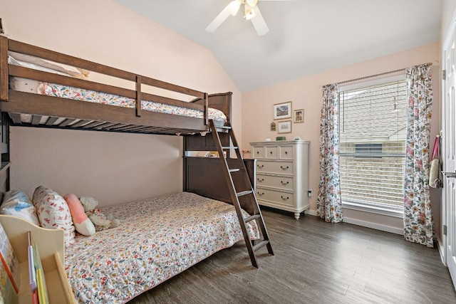 bedroom with dark wood-style flooring, lofted ceiling, baseboards, and a ceiling fan