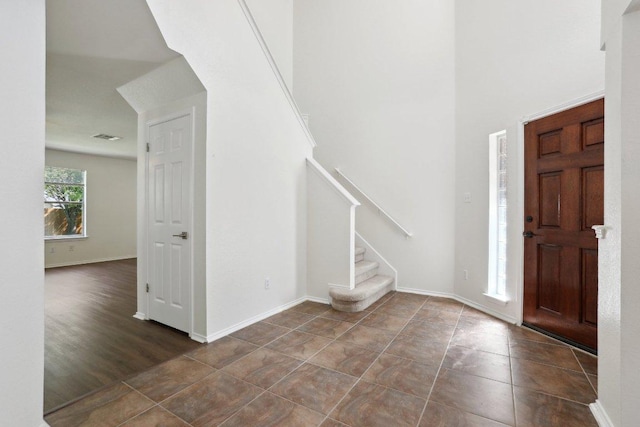 2912 Sydney Dr, Austin, TX 78728 - tiled foyer entrance featuring stairs and a high ceiling