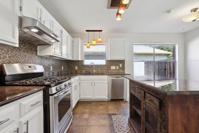 2912 Sydney Dr, Austin, TX 78728 - kitchen with appliances with stainless steel finishes, ventilation hood, backsplash, and plenty of natural light