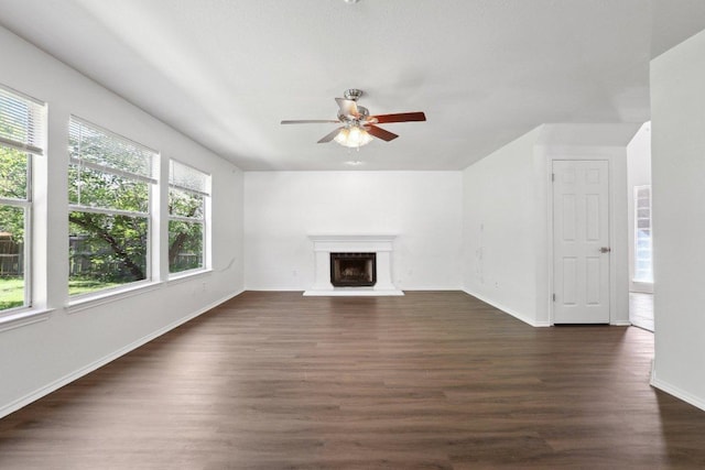 2912 Sydney Dr, Austin, TX 78728 - unfurnished living room featuring ceiling fan, dark wood-style floors, and baseboards