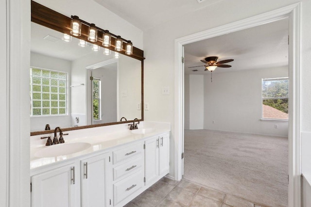 2912 Sydney Dr, Austin, TX 78728 - bathroom featuring a ceiling fan and double vanity