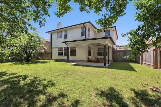 2912 Sydney Dr, Austin, TX 78728 - back of property featuring a ceiling fan, a chimney, and a patio area
