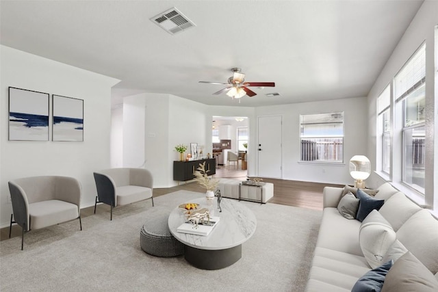 2912 Sydney Dr, Austin, TX 78728 - living area featuring healthy amount of natural light, a ceiling fan, and baseboards