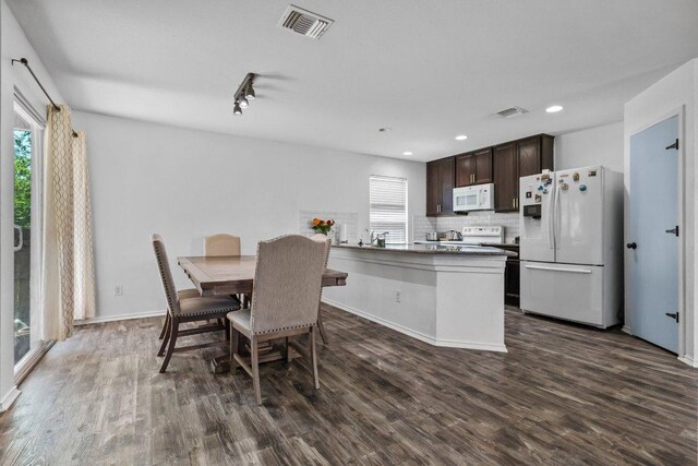 607 Big Bend Trl, Taylor, TX 76574 - dining room with healthy amount of natural light, dark wood finished floors, recessed lighting, and baseboards