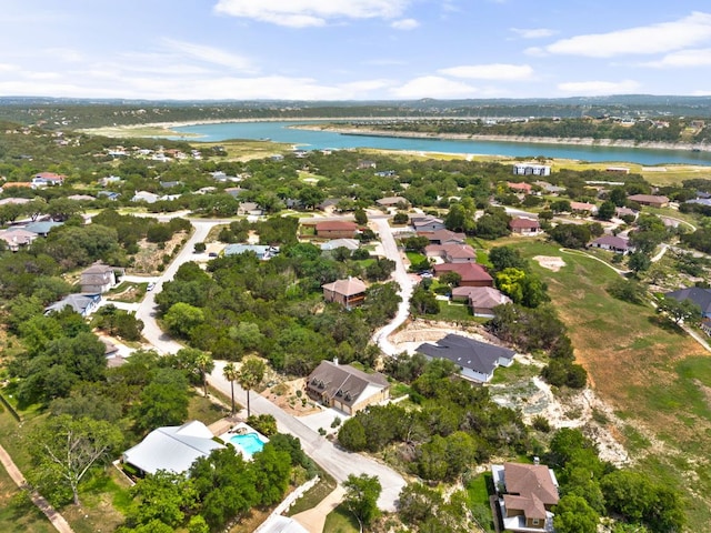 aerial perspective of suburban area with a nearby body of water