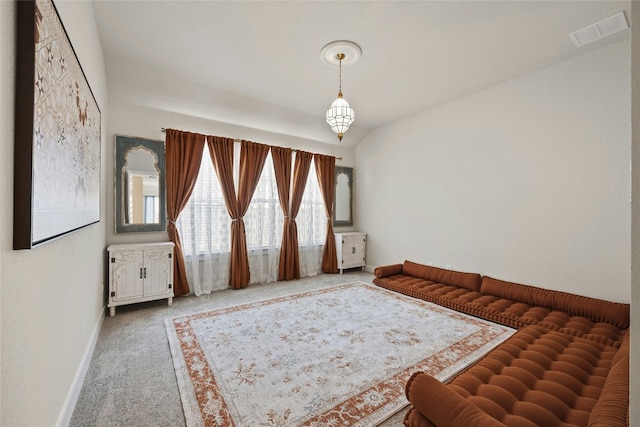sitting room featuring carpet flooring and baseboards