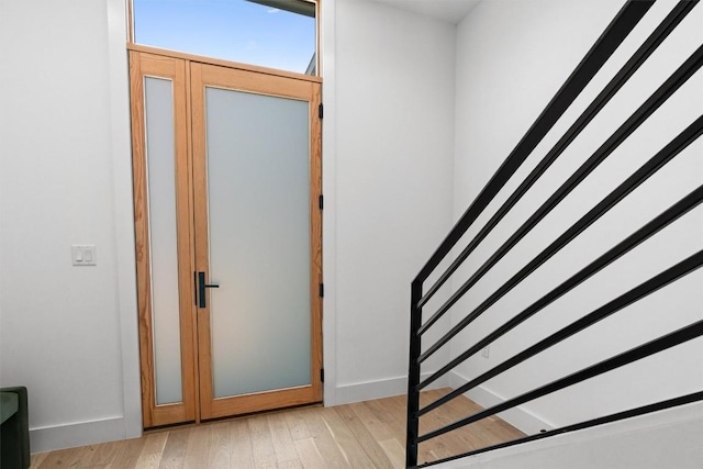 2003 Karen Ave Unit A, Austin, TX 78757 - foyer entrance featuring light wood-style floors, stairway, and baseboards