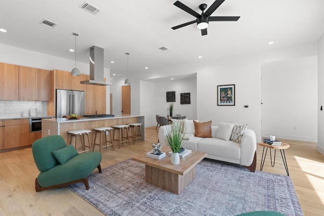 2003 Karen Ave Unit A, Austin, TX 78757 - living room featuring light wood finished floors, a ceiling fan, and recessed lighting