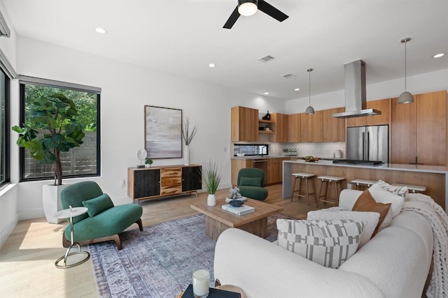 2003 Karen Ave Unit A, Austin, TX 78757 - living area featuring light wood-style flooring, recessed lighting, ceiling fan, and baseboards