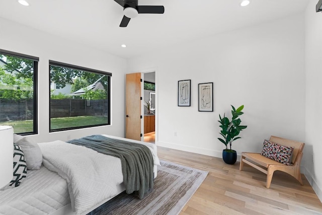 2003 Karen Ave Unit A, Austin, TX 78757 - bedroom with recessed lighting, light wood-style flooring, baseboards, and a ceiling fan