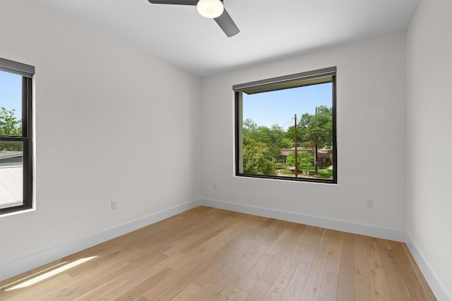 2003 Karen Ave Unit A, Austin, TX 78757 - spare room featuring plenty of natural light, light wood-style flooring, and baseboards