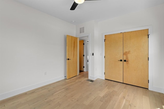 2003 Karen Ave Unit A, Austin, TX 78757 - unfurnished bedroom featuring light wood-type flooring, baseboards, ceiling fan, and a closet