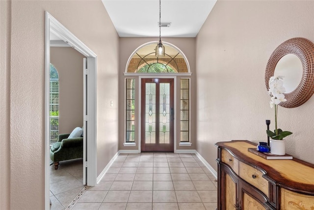 2415 Arbor Dr, Round Rock, TX 78681 - foyer with baseboards and light tile patterned floors