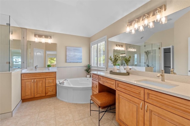 2415 Arbor Dr, Round Rock, TX 78681 - bathroom with a stall shower, two vanities, a garden tub, and tile patterned floors