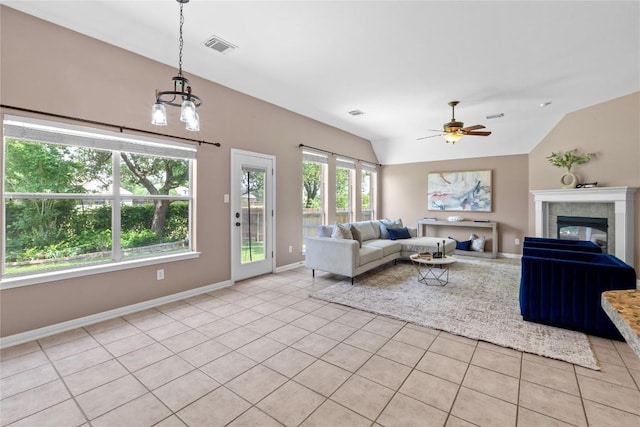 2415 Arbor Dr, Round Rock, TX 78681 - living room featuring vaulted ceiling, a ceiling fan, light tile patterned flooring, a chandelier, and baseboards