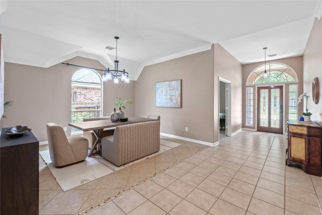 2415 Arbor Dr, Round Rock, TX 78681 - dining space featuring light tile patterned floors, baseboards, a chandelier, vaulted ceiling, and ornamental molding