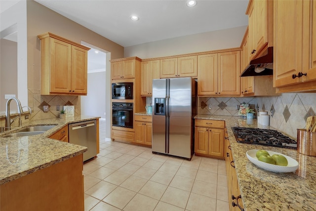 2415 Arbor Dr, Round Rock, TX 78681 - kitchen with black appliances, a sink, under cabinet range hood, light stone countertops, and backsplash