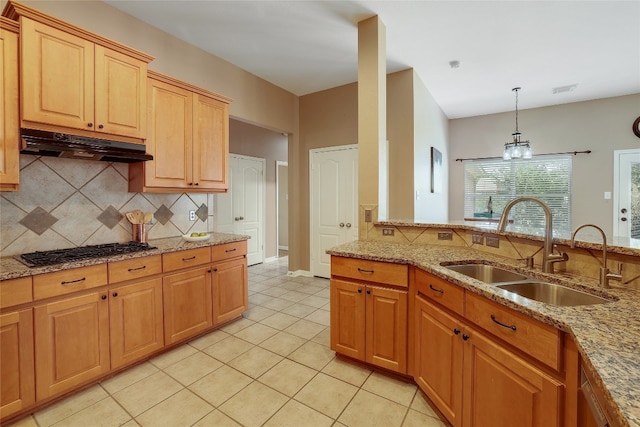 2415 Arbor Dr, Round Rock, TX 78681 - kitchen featuring under cabinet range hood, a sink, gas cooktop, and backsplash