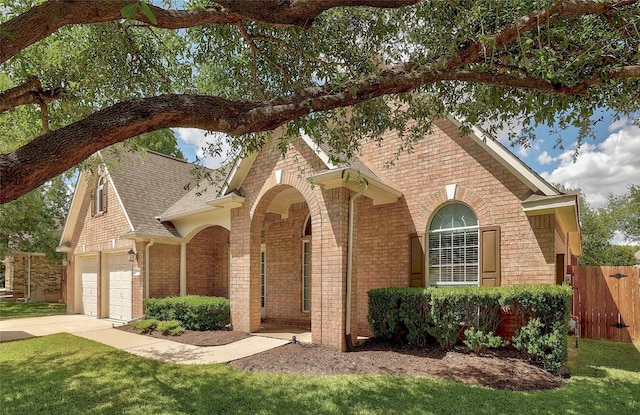 2415 Arbor Dr, Round Rock, TX 78681 - view of front of home with brick siding, roof with shingles, and driveway