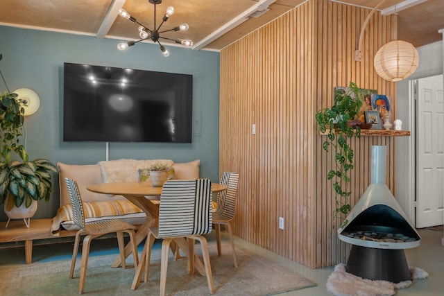 1644 Chippeway Ln, Austin, TX 78745 - dining area featuring a chandelier and wooden walls