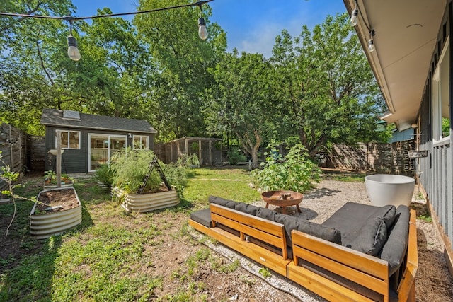 view of yard with an outbuilding and a vegetable garden
