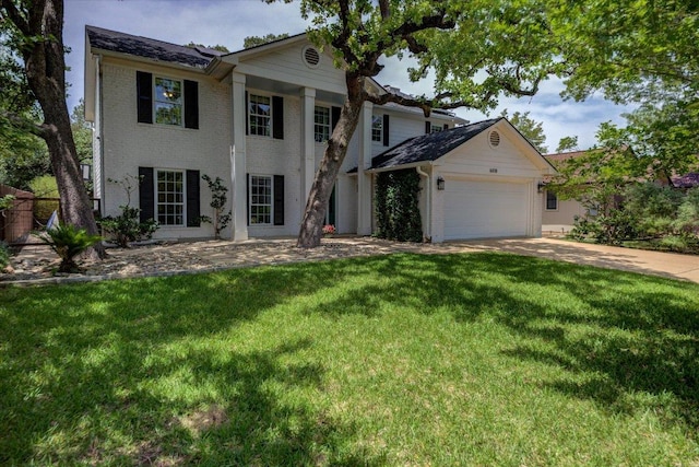 6018 Abilene Trl, Austin, TX 78749 - neoclassical home featuring brick siding, a garage, driveway, and a front yard