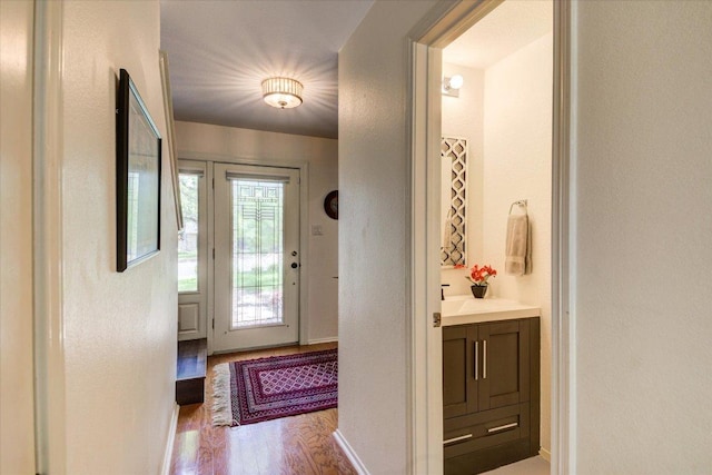 6018 Abilene Trl, Austin, TX 78749 - entryway with wood finished floors, a textured wall, and baseboards