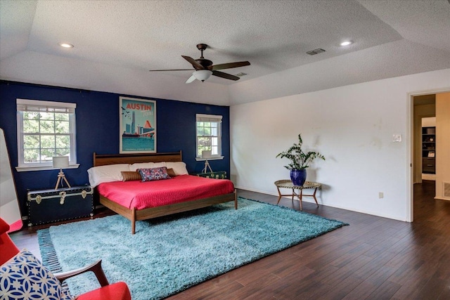 6018 Abilene Trl, Austin, TX 78749 - bedroom with a textured ceiling, wood finished floors, lofted ceiling, a ceiling fan, and baseboards