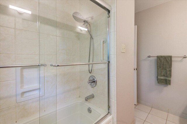 6018 Abilene Trl, Austin, TX 78749 - bathroom with shower / bath combination with glass door, tile patterned flooring, and baseboards