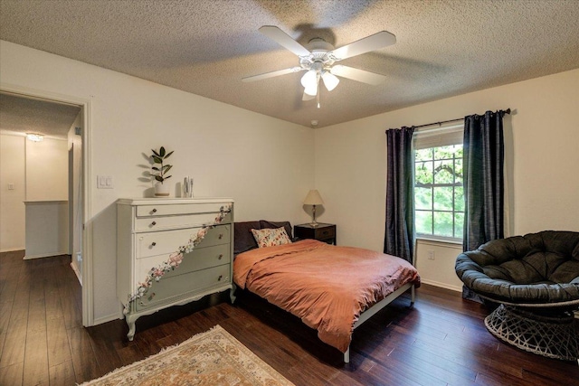 6018 Abilene Trl, Austin, TX 78749 - bedroom featuring wood-type flooring, a textured ceiling, baseboards, and ceiling fan