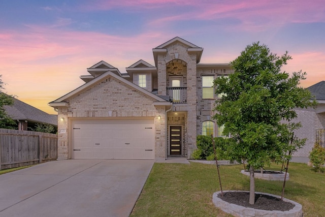 4418 Royal Oak Blvd, San Marcos, TX 78666 - view of front of property with a garage, brick siding, concrete driveway, and a balcony