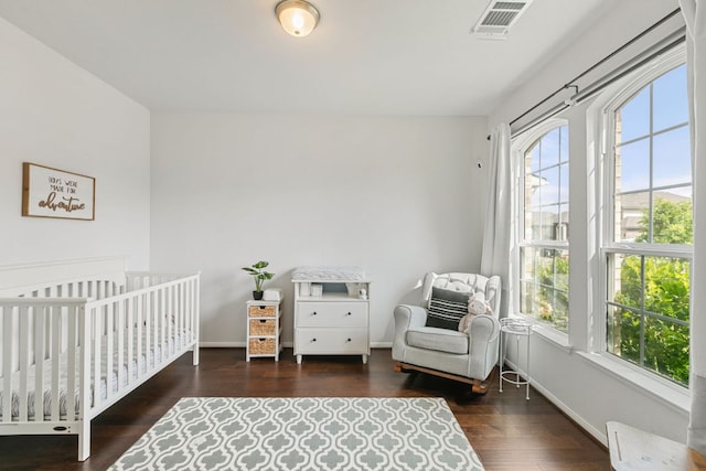 4418 Royal Oak Blvd, San Marcos, TX 78666 - bedroom with wood finished floors, a nursery area, and baseboards