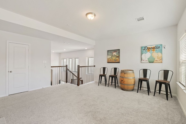4418 Royal Oak Blvd, San Marcos, TX 78666 - living area featuring carpet, an upstairs landing, baseboards, and recessed lighting
