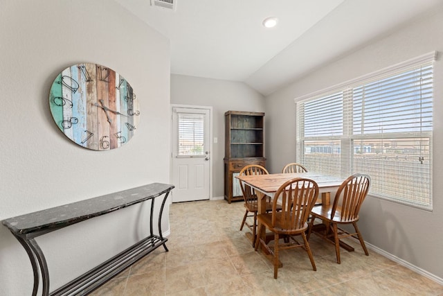 200 Circle Way Unit 8E, Jarrell, TX 76537 - dining space featuring vaulted ceiling and baseboards