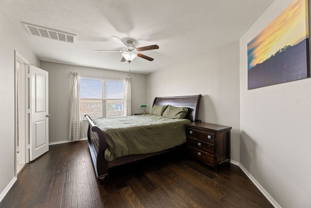 200 Circle Way Unit 8E, Jarrell, TX 76537 - bedroom featuring dark wood finished floors, baseboards, and a ceiling fan