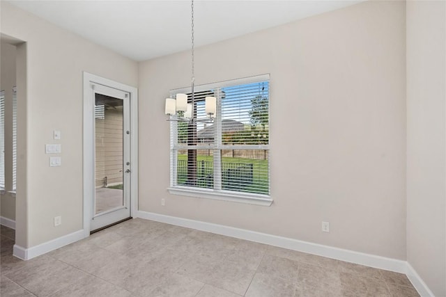 2713 Margarita Ct, Round Rock, TX 78665 - unfurnished dining area with baseboards, a chandelier, and light tile patterned floors