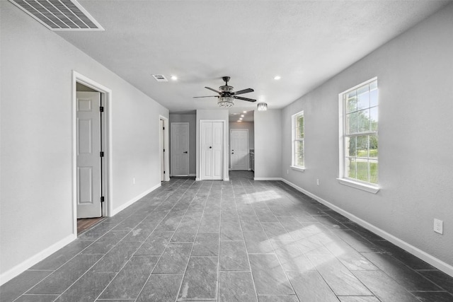7000 Carwill Dr, Austin, TX 78724 - unfurnished living room with recessed lighting, baseboards, and a ceiling fan