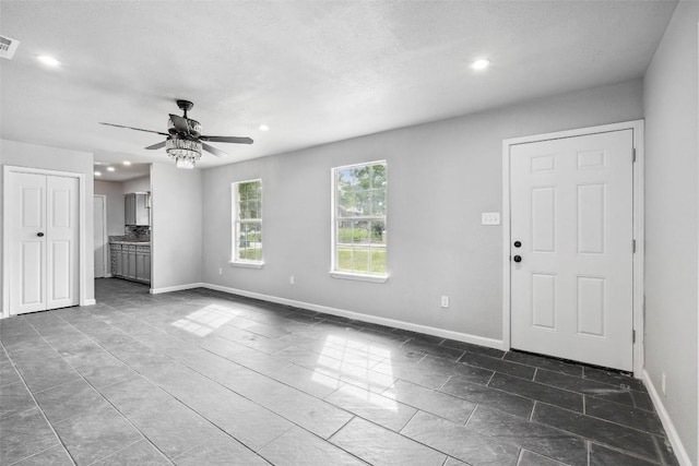 7000 Carwill Dr, Austin, TX 78724 - unfurnished living room featuring recessed lighting, ceiling fan, and baseboards