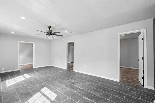 7000 Carwill Dr, Austin, TX 78724 - empty room with a ceiling fan, recessed lighting, baseboards, and a textured ceiling