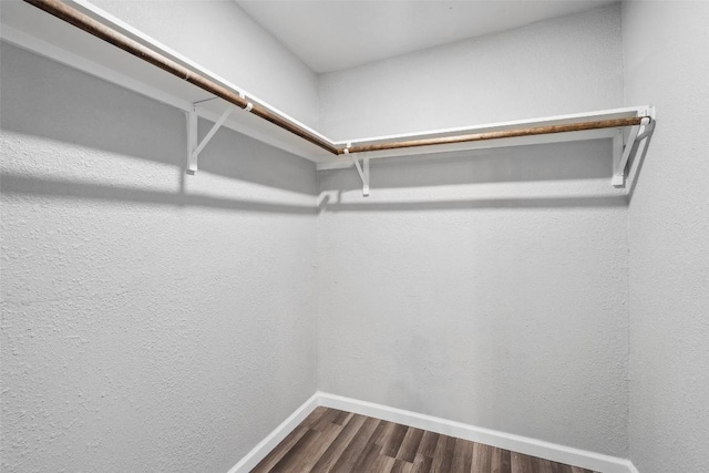 7000 Carwill Dr, Austin, TX 78724 - walk in closet featuring dark wood finished floors