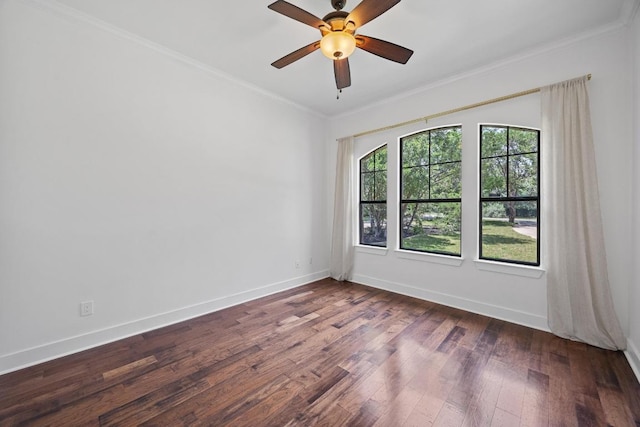 unfurnished room with wood finished floors, crown molding, baseboards, and a ceiling fan