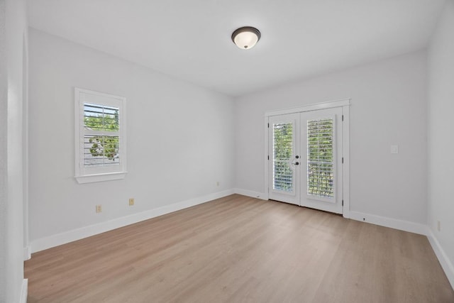 206 Lido St, Austin, TX 78734 - spare room with plenty of natural light, french doors, light wood finished floors, and baseboards