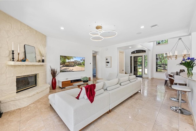 206 Lido St, Austin, TX 78734 - living room with a chandelier, recessed lighting, and a fireplace