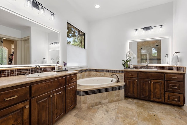 206 Lido St, Austin, TX 78734 - bathroom with a garden tub, a tile shower, two vanities, and tasteful backsplash