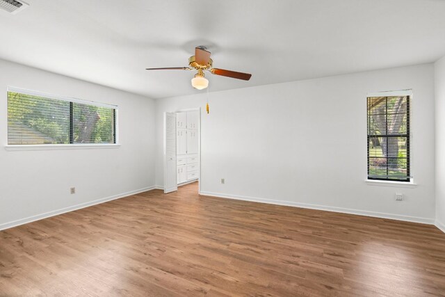 507 Canyon Wren Dr, Buda, TX 78610 - empty room featuring wood finished floors, ceiling fan, and baseboards
