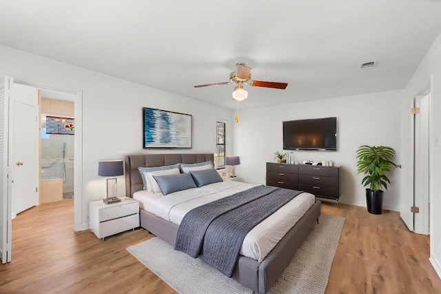 507 Canyon Wren Dr, Buda, TX 78610 - bedroom featuring multiple windows, light wood-style floors, and a ceiling fan