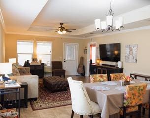 834 Salado Creek Ln, Georgetown, TX 78633 - dining room with plenty of natural light, a raised ceiling, and a chandelier