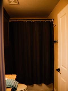834 Salado Creek Ln, Georgetown, TX 78633 - full bathroom featuring a shower with shower curtain and toilet