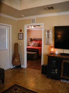 834 Salado Creek Ln, Georgetown, TX 78633 - tiled bedroom featuring crown molding